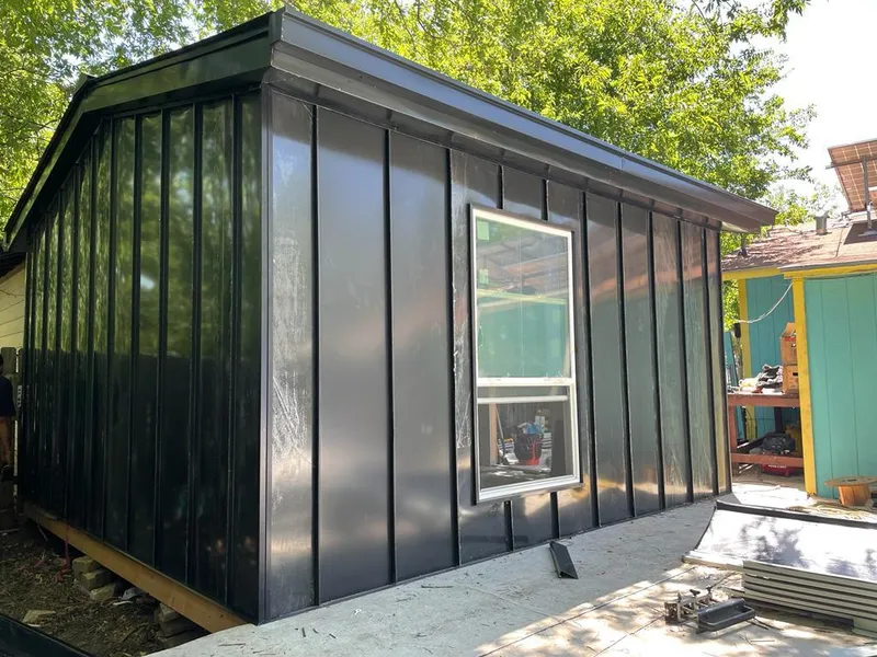 Black standing seam metal wall panels for Roof Inspection in Warrington